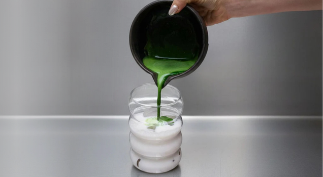 step 4: pouring matcha over ice and milk to make an iced matcha latte